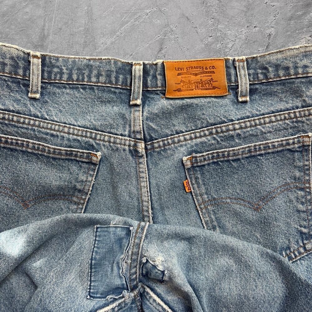 Vintage 90s Levi's 550 made in USA yellow tab repaired patchwork jeans